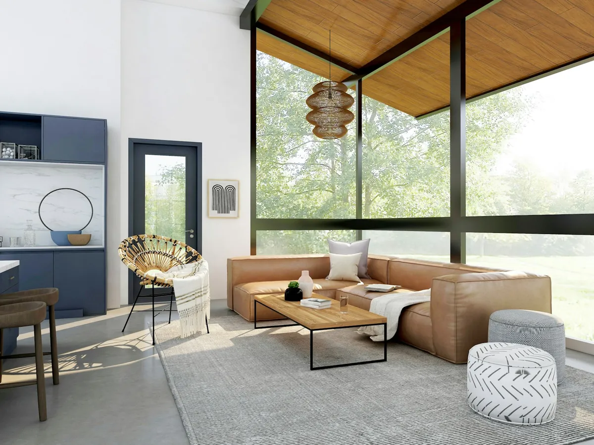Loft moderno de concepto abierto con sofá azul y grandes ventanas